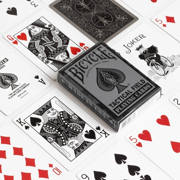Bicycle tactical field playing cards with cards spread out on a white background
