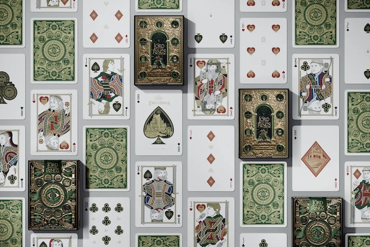 Collection of playing cards with various designs and suits on a white background